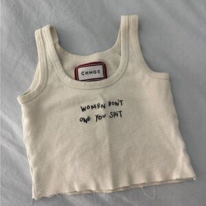 CHNGE Women Don’t Owe You Cream Ribbed Tank Top with Embroidered Slogan